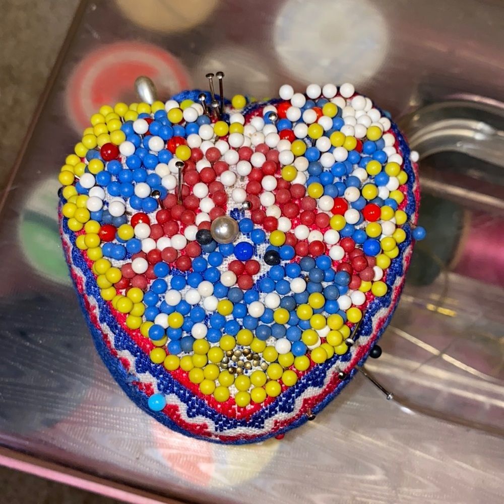 Vintage heart shaped pincushion. Red, white, and blue with yellow